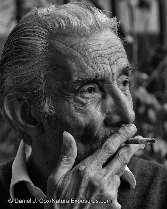An older gentleman drags on a cigarette while playing cards at the Sorrento c'è la Società Operaia. In english this is known as Workers' Mutual Aid Society founded in Sorrento in 1877 and established to help sick or older workers who could no longer perform their duties. Now it's more like why we might call the American Legion or the Elks Club. It's a great place for groups of old men to get together and sure each others company while playing cards. Lumix GH4 with 45-175mm. 