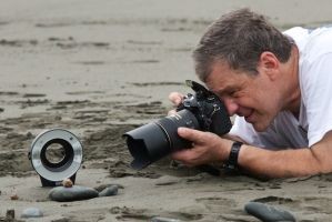 Dan gets down to eye level with a hermit crab in Costa Rica