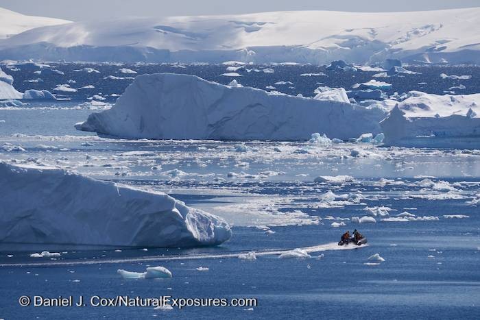 Zodiac going back to the Seabourn ship through ice. Cuverville Island. Antarctica. Lumix GH3.