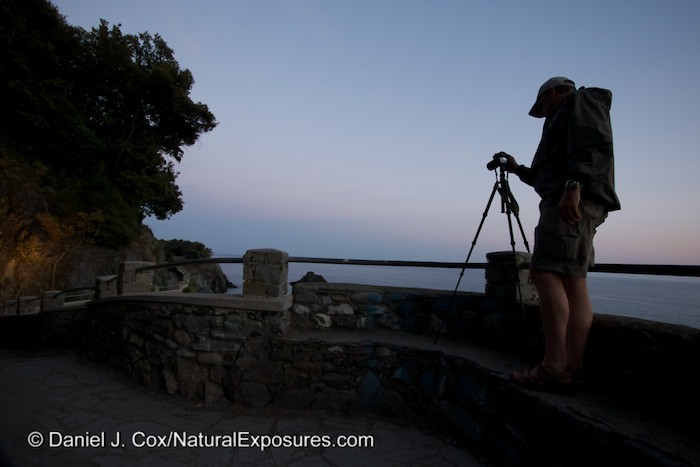 Dan shooting the blue light of dusk along the cliffs of Monterosso, Italy