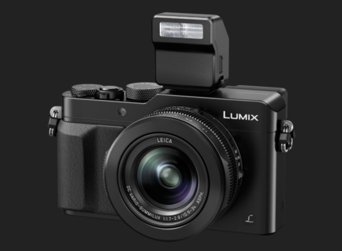 Panasoinc's new Lumix LX100 with 24-75mm F/1.7-2.8 zoom. It has a Micro Four Thirds sensor and built in EVF. 