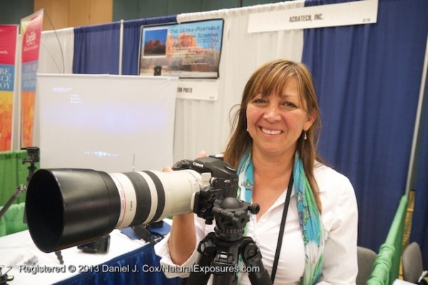 Patty Sullivan of Acratech shows off one of their ball heads at the Acratech booth during the 2013 NANPA Conference in Jacksonville, Florida