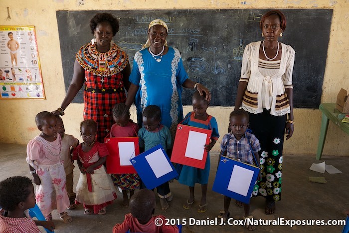 Rose Lisamba with her two teaching colleagues and several children from their Samburu village school. Kenya