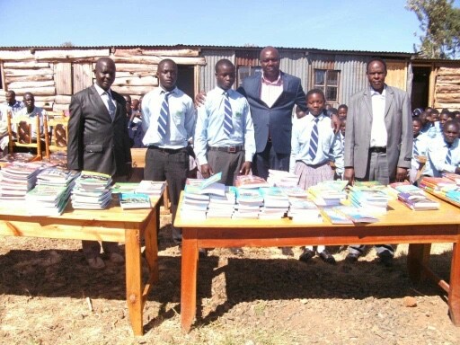 Henry Miwani, the man I affectionally call Super Masai is in the middle of this group, there really tall guy with a black suit. Couldn't not do any of this without him and his wife. 