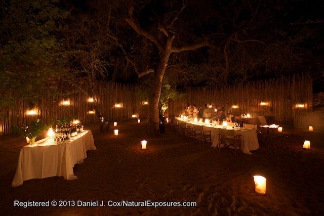 Candles light the outside eating area for our first dinner.