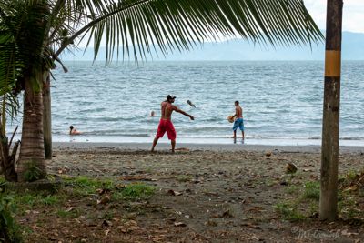 Bottle juggler on beach