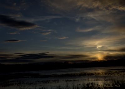 I loved the swirls of clouds and water reflections in this photo.