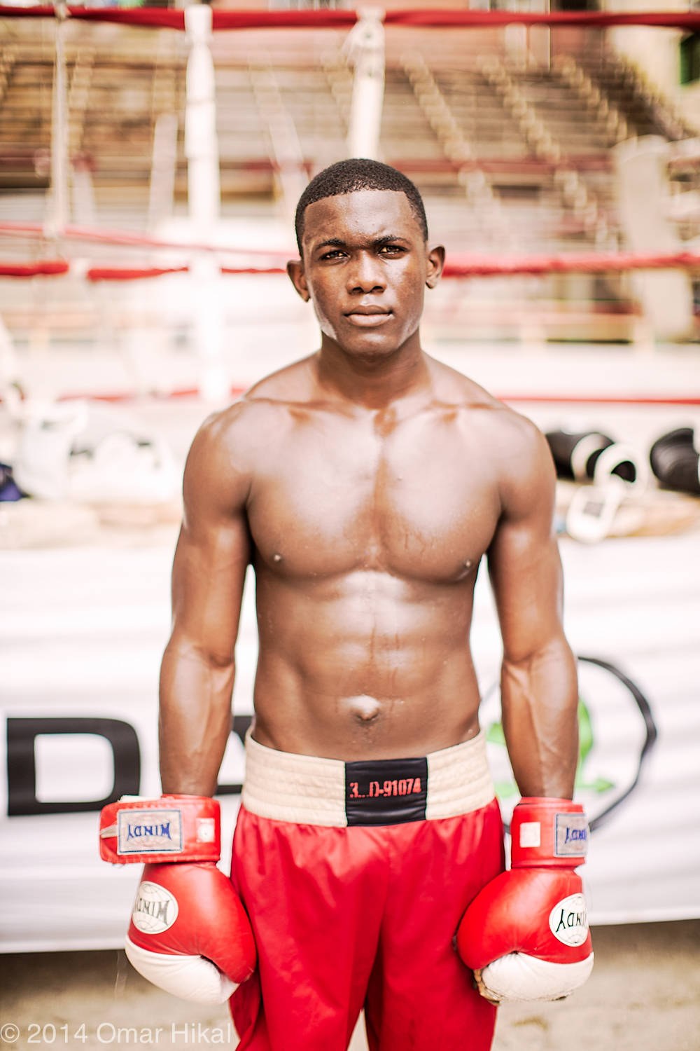 Boxer in red shorts in Cuba, photographed by Omar Hikal